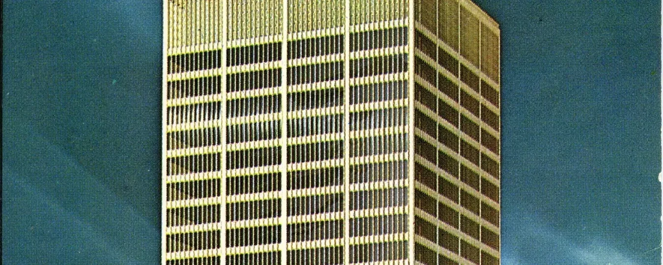 Tall skyscraper against a clear blue sky.