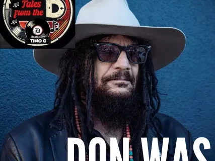 Man with long dark hair, mustasche, and beard, wearing a white brimmed hat and sunglasses against a blue background. The words Don Was are on the bottom, and the Tales from the D logo is in the upper left corner.