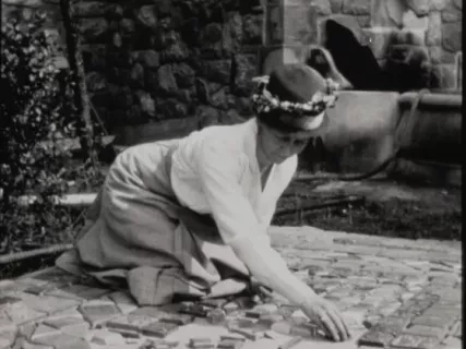 Negative, Film - Miss Perry at work with her tiles
