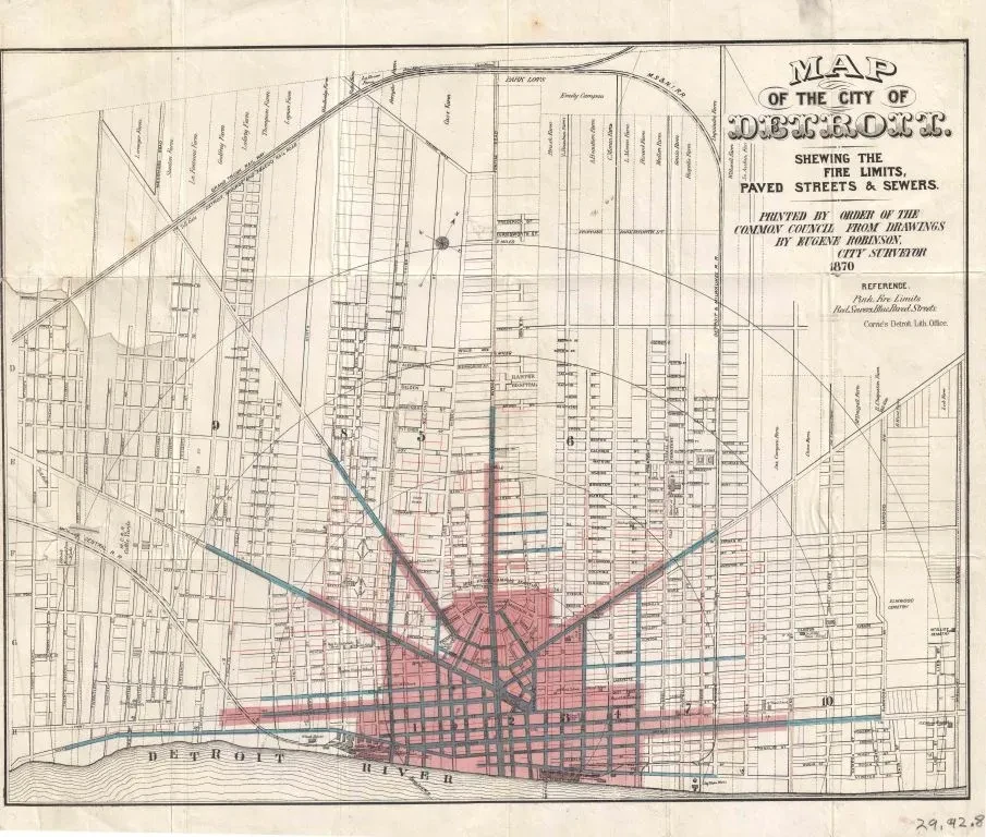 Historic map of Knoxville, displaying street layouts and city limits. Red and blue lines highlight specific areas and routes.