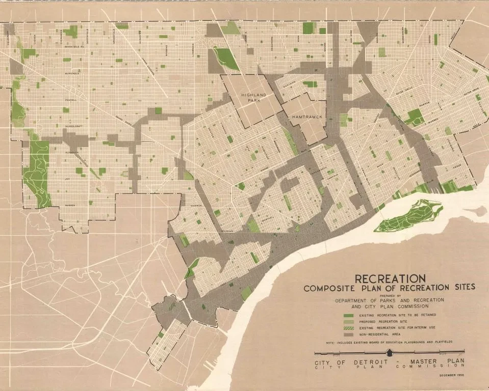 Map of a city layout showing green recreational areas and proposed school playgrounds, with a legend for reference.